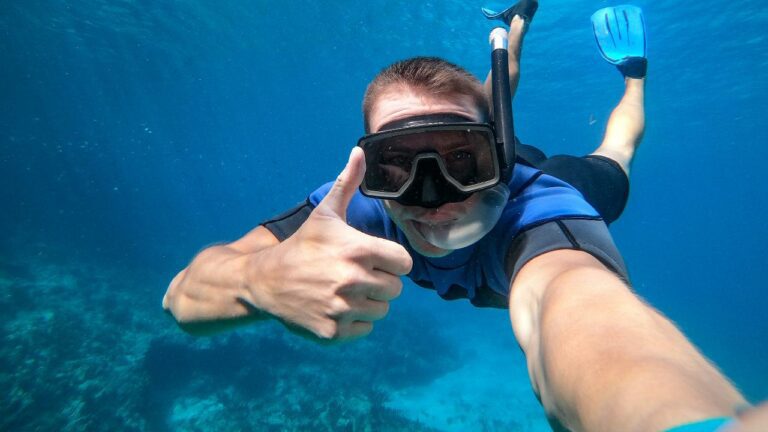 snorkel diver giving thumbs up